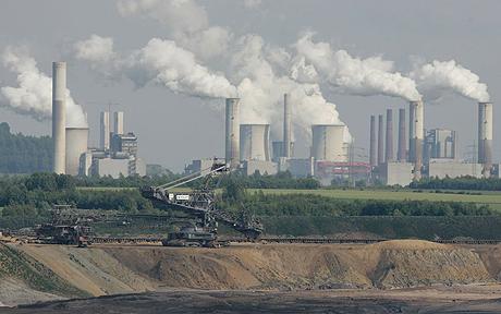 Despite High Emissions, New Coal Power Plants Planned in Germany...AACHEN, GERMANY - MAY 15:  Behind the open-pit coal mine Gartzweiler exhaust rises from cooling towers at the lignit coal-fired power stations Frimmersdorf, Neurath and Niederaussem May 15, 2007 near Aachen, Germany. The four German major energy providers Vattenfall, RWE, E.on and EnBW plan to invest more than 30 billion euros in construction and infrastructure of cole conducted power plants in Germany.  (Photo by Ralph Orlowski/Getty Images)